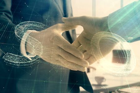 Multi exposure of seo icon hologram on office background with two men handshake. Concept of data searchの写真素材