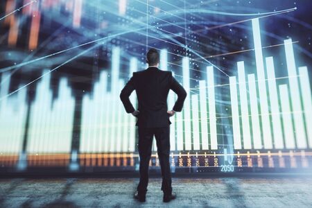 Businessman and forex graph hologram. Double exposure. Concept of financial education and analysisの写真素材