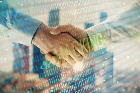 Multi exposure of digital crime theme hologram on city view background with two people handshake. Concept of securitizationの写真素材