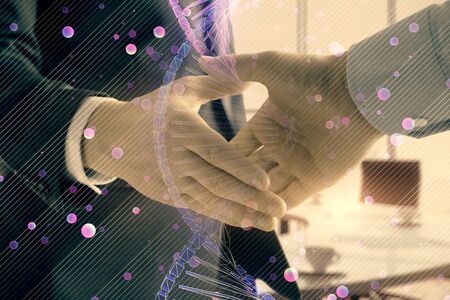 Multi exposure of DNA icon hologram on office background with two men handshake. Concept of...