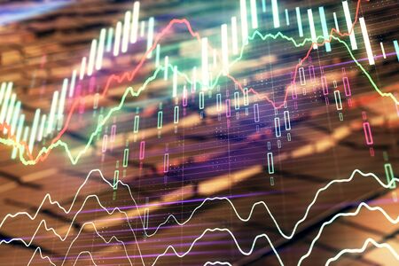 Financial chart hologram with abstract background. Double exposure. Concept of market analysisの写真素材