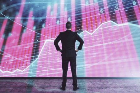 Businessman and forex graph hologram. Double exposure. Concept of financial education and analysis