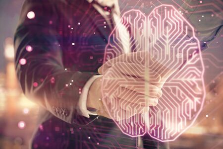 Double exposure of human brain drawing on city view background with handshake. Concept of brainstormの写真素材