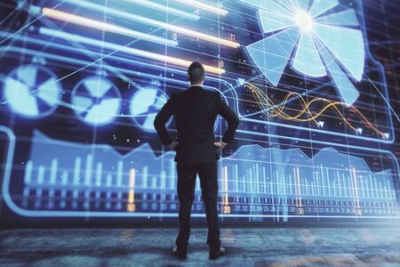 Businessman standing with business theme hologram. Multi exposure. Concept of analysisの写真素材