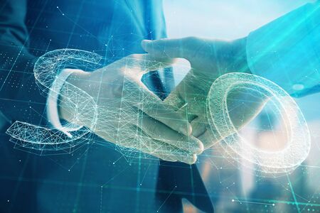 Double exposure of SEO sign hologram on city view background with two people handshake. Concept of search optimization in businessの写真素材