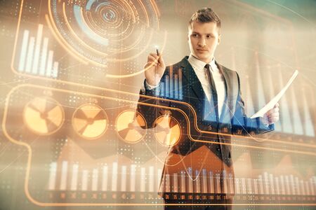 Businessman standing with business theme hologram. Multi exposure. Concept of analysisの写真素材