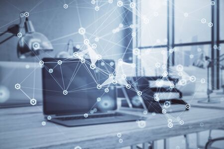 Technology theme hologram and desktop office computer background. Double exposure. Concept of high technologyの写真素材