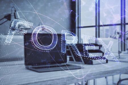 Forex graph hologram with desktop office computer background. Double exposure. Concept of financial analysis.の写真素材