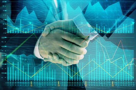 Multi exposure of forex graph on abstract background with two businessmen handshake. Concept of success on stock marketの写真素材