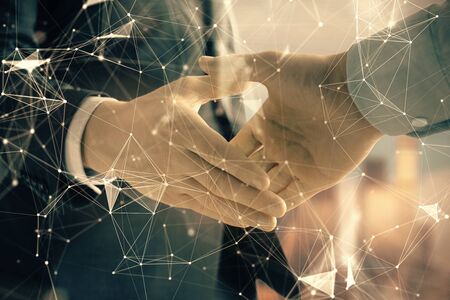 Double exposure of abstract technology drawing on cityscape background with two businessmen handshake. Concept of tech role in business