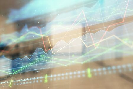 Stock market chart with trading desk bank office interior on background. Double exposure. Concept of financial analysisの写真素材
