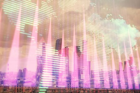 Double exposure of financial graph and world map on city veiw background. Concept of financial market research and analysisの写真素材
