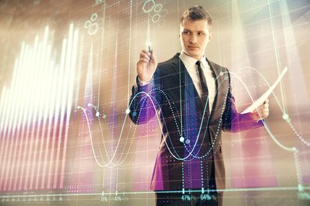 Businessman and forex graph hologram. Double exposure. Concept of financial education and analysisの写真素材