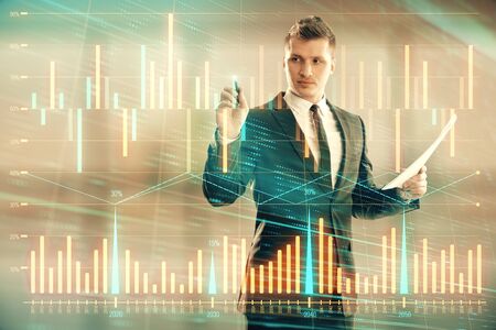 Businessman and forex graph hologram. Double exposure. Concept of financial education and analysisの写真素材
