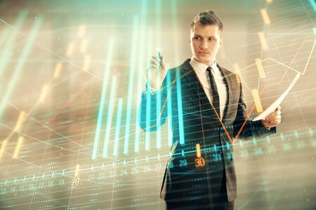 Businessman and forex graph hologram. Double exposure. Concept of financial education and analysisの写真素材