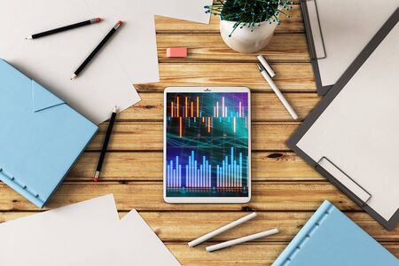 Digital tablet closeup top view with financial graph on screen. Online trading application concept. 3d rendering.の写真素材