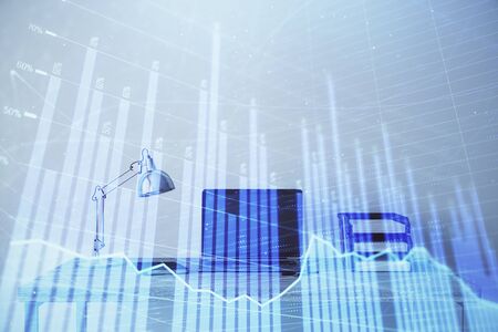 Stock market chart and desktop office computer background. Multi exposure. Concept of financial analysis.の写真素材