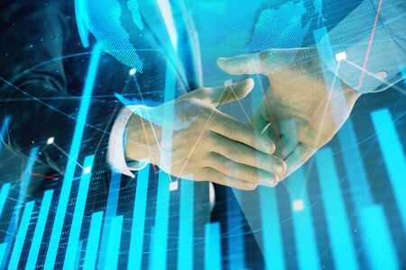 Multi exposure of forex graph and world map on abstract background with two businessmen handshake. Concept of success on international marketsの写真素材