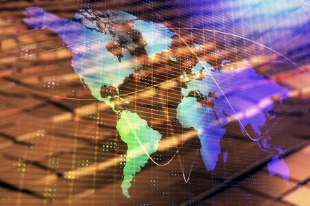 Globe hologram and abstract background. Double exposure. Concept of international business.の写真素材