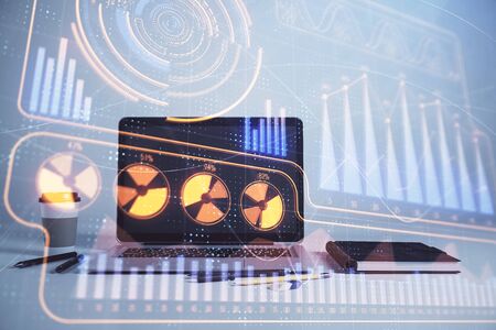 Business theme concept hologram with desktop office background. Double exposure.の写真素材