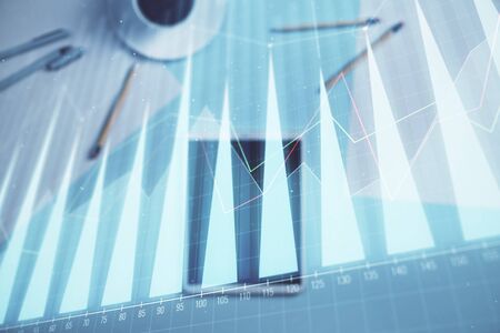 Double exposure of forex graph on digital tablet laying on table background. Concept of market analysisの写真素材