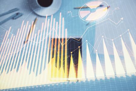 Double exposure of forex graph on digital tablet laying on table background. Concept of market analysisの写真素材