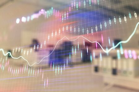Stock market chart with trading desk bank office interior on background. Double exposure. Concept of financial analysisの写真素材