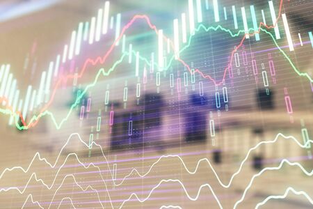 Stock market chart with trading desk bank office interior on background. Double exposure. Concept of financial analysisの写真素材