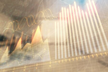 Stock market chart with trading desk bank office interior on background. Double exposure. Concept of financial analysisの写真素材