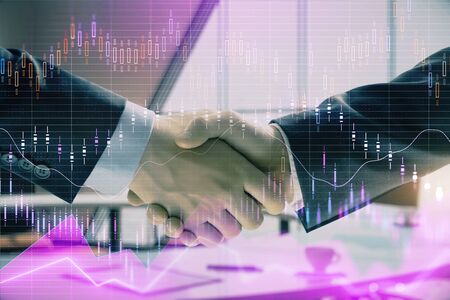 Multi exposure of financial graph on office background with two businessmen handshake. Concept of success in businessの写真素材