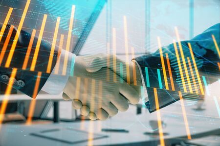 Multi exposure of financial chart and map on office background with two businessmen handshake. Concept of success in businessの写真素材
