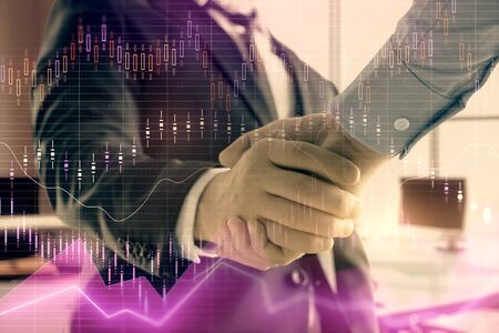 Multi exposure of financial graph on office background with two businessmen handshake. Concept of success in businessの写真素材