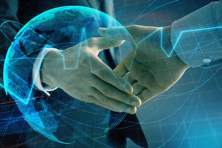 Multi exposure of forex graph and world map on abstract background with two businessmen handshake. Concept of success on international marketsの写真素材