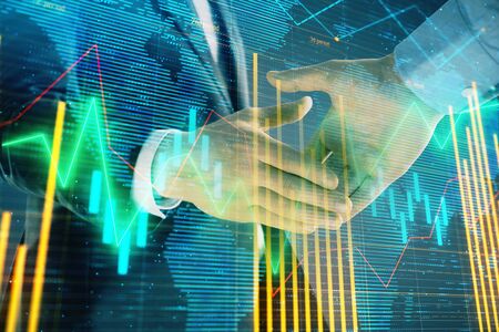 Multi exposure of forex graph and world map on abstract background with two businessmen handshake. Concept of success on international marketsの写真素材