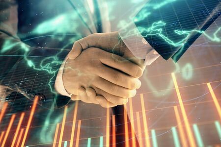 Multi exposure of forex graph and world map on abstract background with two businessmen handshake. Concept of success on international marketsの写真素材