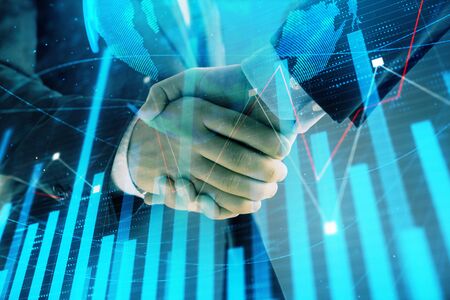 Multi exposure of forex graph and world map on abstract background with two businessmen handshake. Concept of success on international marketsの写真素材