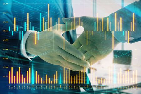 Multi exposure of financial graph on office background with two businessmen handshake. Concept of success in businessの写真素材
