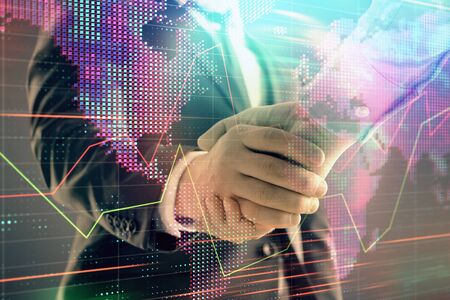 Multi exposure of forex graph and world map on abstract background with two businessmen handshake. Concept of success on international marketsの写真素材