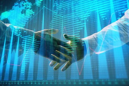 Multi exposure of forex graph and world map on abstract background with two businessmen handshake. Concept of success on international marketsの写真素材