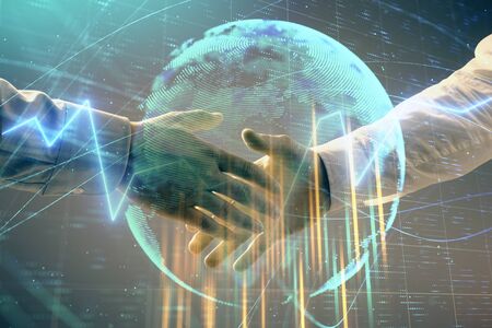Multi exposure of forex graph and world map on abstract background with two businessmen handshake. Concept of success on international marketsの写真素材