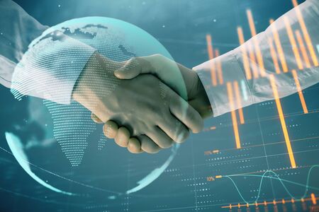 Multi exposure of forex graph and world map on abstract background with two businessmen handshake. Concept of success on international marketsの写真素材