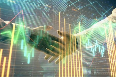 Multi exposure of forex graph and world map on abstract background with two businessmen handshake. Concept of success on international marketsの写真素材