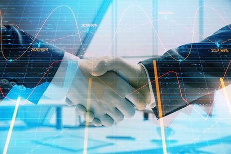 Multi exposure of financial graph on office background with two businessmen handshake. Concept of success in businessの写真素材
