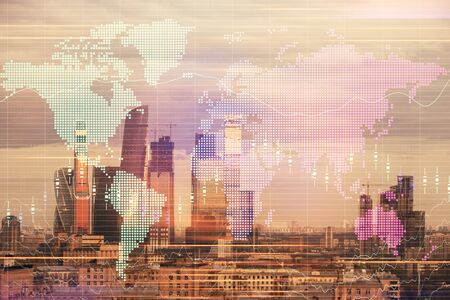 Double exposure of financial graph and world map on city view background. Concept of financial market research and analysisの写真素材
