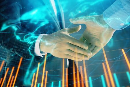 Multi exposure of forex graph and world map on abstract background with two businessmen handshake. Concept of success on international marketsの写真素材