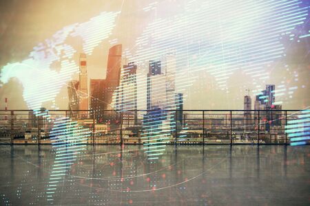 Map hologram with city view from roof background. Double exposure.の写真素材