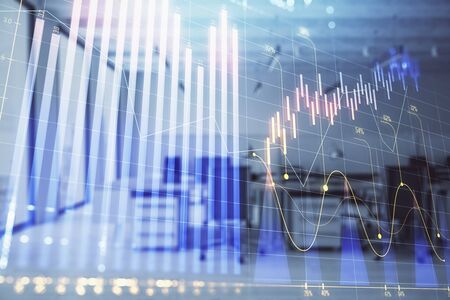 Stock and bond market graph with trading desk bank office interior on background. Multi exposure. Concept of financial analysisの写真素材