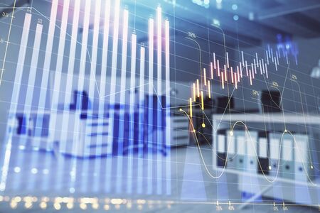 Stock market chart with trading desk bank office interior on background. Double exposure. Concept of financial analysisの写真素材
