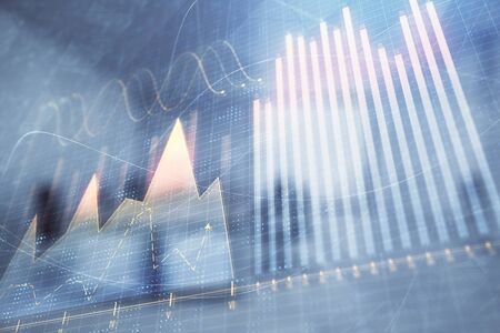 Stock market chart with trading desk bank office interior on background. Double exposure. Concept of financial analysisの写真素材