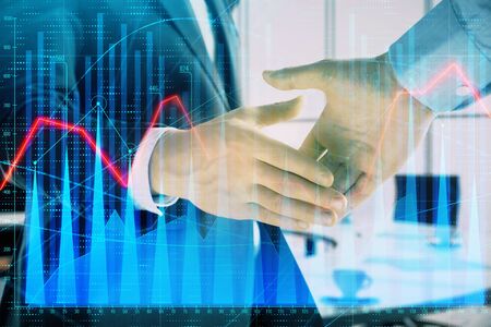Multi exposure of financial graph on office background with two businessmen handshake. Concept of success in businessの写真素材